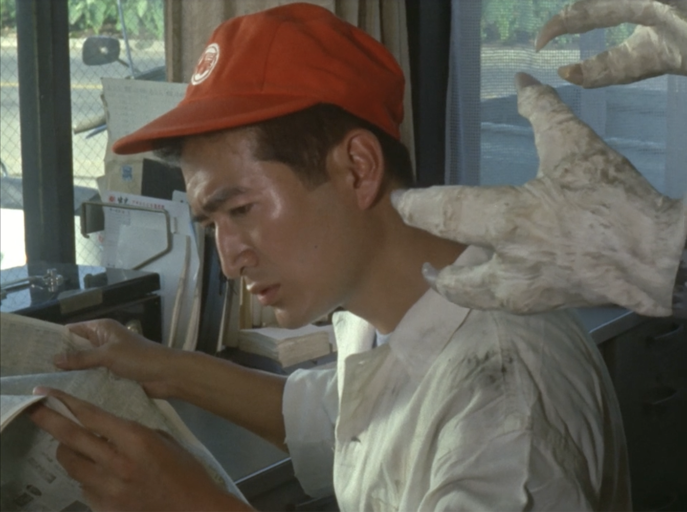 Alien Quraso about to kill a gas station attendant in Ultraseven episode "Space Prisoner 303.)